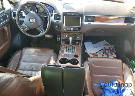 2011 Volkswagen Touareg Hybrid z USA, uszkodzony, nr VIN WVGFG9BP6BD003285